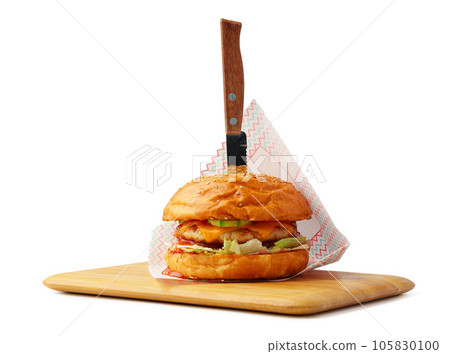 Delicious burger on wooden board isolated on white background 105830100