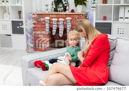 Conversation between mother and son in a Christmas atmosphere 107476677