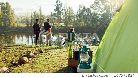 Fishing, camping and friends by lake in nature on holiday, adventure and vacation together outdoors. Campsite, relax and men and woman with rod by river for sports hobby, activity and catch fish 107575824