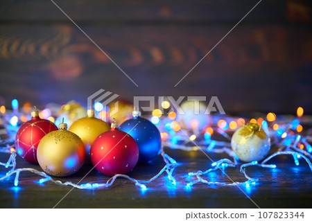 Colorful Christmas balls Christmas baubles and xmas lights background 107823344