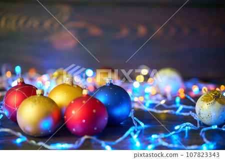 Colorful Christmas balls Christmas baubles and xmas lights background 107823343