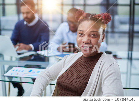 Studio portrait of happy successful confident black business woman. 107844143