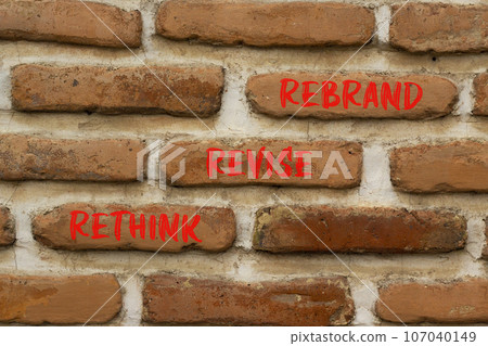 Rethink revise rebrand symbol. Concept word Rethink Revise Rebrand on beautiful bricks. Beautiful red brown brickwall background. Business brand motivational rethink revise rebrand concept. Copy space 107040149