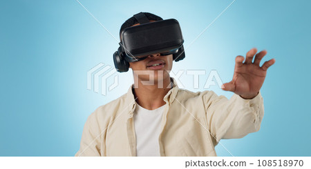 Man, student and VR or futuristic glasses for e learning, 3d software and user experience on blue background. Person with virtual reality vision, education and metaverse technology or games in studio 108518970