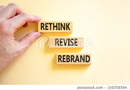 Rethink revise rebrand symbol. Concept word Rethink Revise Rebrand on beautiful block. Beautiful white table white background. Business brand motivational rethink revise rebrand concept. Copy space. 108708564