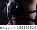 Image of womans breast in bandage belt 108895814