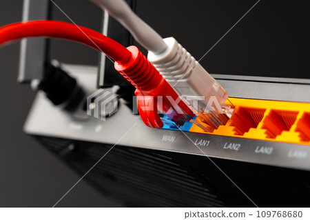 Modern router with cables plugged in close up 109768680