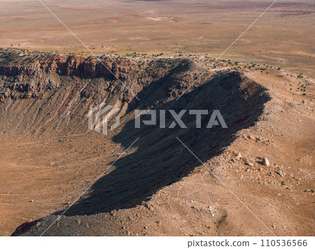 Aerial view of the Meteor Crater Natural Landmark at Arizona. Crater from a meteorite, from space. Elements of this image furnished by NASA. High quality photo 110536566