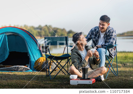 Happy Asian male gay couple on camping together in a forest. romantic vocation trip. lgbt concept 110717384