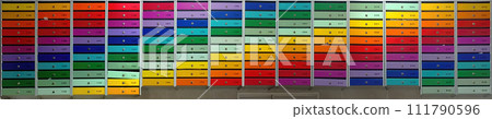 Ultra wide panorama of multicolored mailboxes of a residential apartment building. 111790596