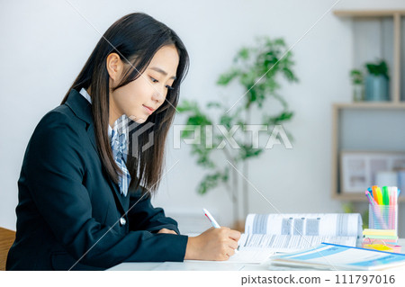 School girls studying 111797016