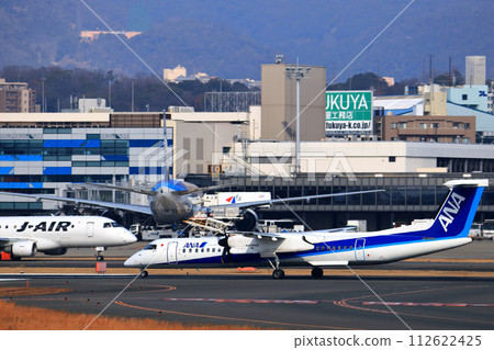 Osaka International Airport ANA Bombardier DHC8-Q400 Propeller Aircraft Takeoff Ready Sky Park 112622425