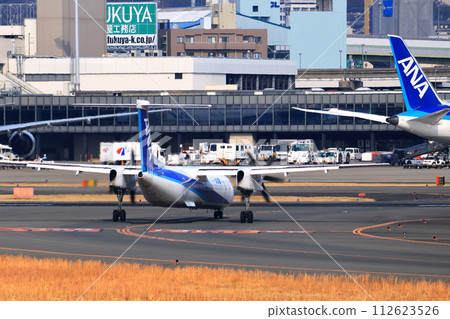 Osaka International Airport ANA Bombardier DHC8-Q400 propeller plane landing preparation Skypark 112623526