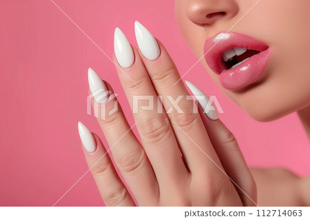 Black woman posing with white nail 112714063