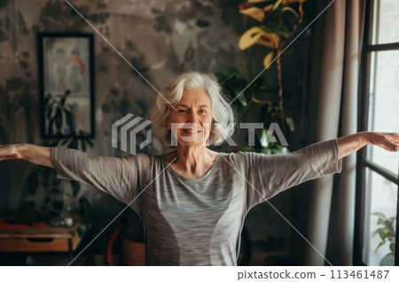 Happy senior woman doing arm stretch in yoga session at home. Generative AI 113461487