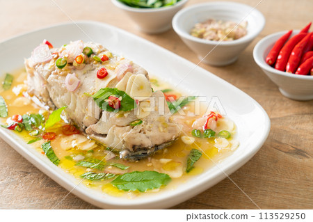 steamed sea bass fish with herbs 113529250