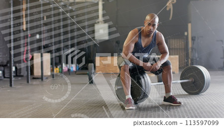 Image of data processing on interface over biracial man sitting on barbell weights at gym 113597099