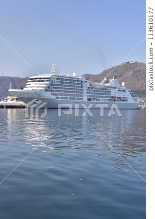 Photographing the scenery of the cruise ship Silver Muse docking at Hakodate Port in Hakodate City, Hokkaido in spring 113610177