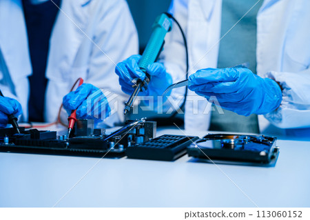 Close up of Technician measuring voltage electronic circuit board, Service after sale fix electric equipment. 113060152