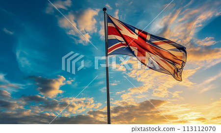 Flag of the United Kingdom of Great Britain and the North against a beautiful northern sky with magnificent clouds at sunset, NATO summit in Europe, participant flags with space for concept 113112070