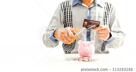 Man using scissors to cut credit card. Concept money, saving, Financial stability, Stop luxury, Create investment opportunity, Start a new business, Bankruptcy protection. Selective focus, copy space 113283288