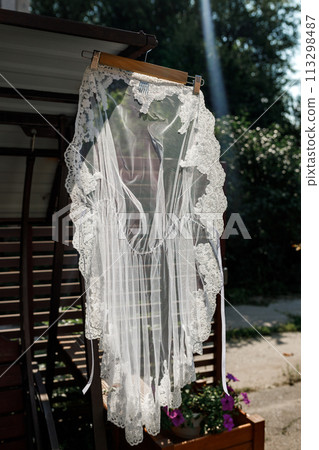 Wedding veil hanging on a hanger 113298487