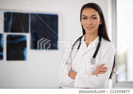 Portrait, confident doctor and woman in hospital for healthcare, wellness or xray in Brazil. Face, medical professional and employee with arms crossed, worker or radiology expert with pride in clinic 113344677