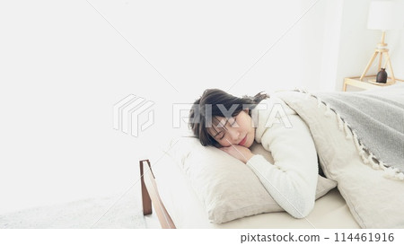 Asian woman sleeping on stomach 114461916