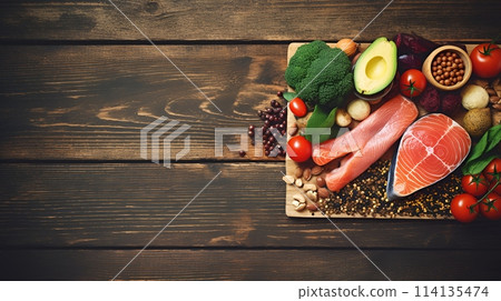 A variety of nutritious foods are on a wooden table 114135474