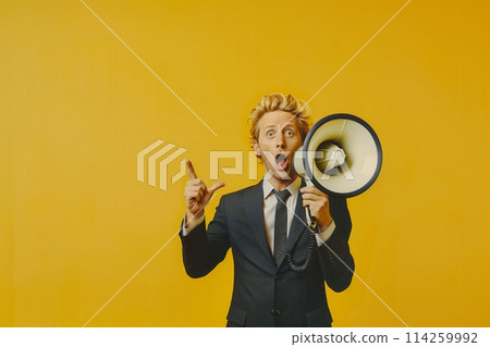 The man with a megaphone on yellow background 114259992