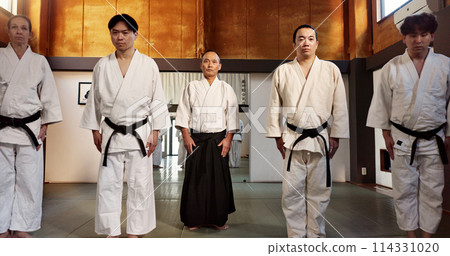 Japanese students, bow or learning aikido in dojo, training and modern martial arts for self defence or respect. Group, black belt class and sensei in instruction, honor and discipline in commitment 114331020