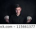 Gambler holding playing cards in both hands. Royal flush successful poker combinations. Casino games tournament advertisement. Lucky gamer or magician showing tricks against dark background 115661377