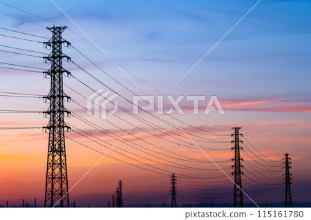 A row of power transmission towers and a sunset sky b-4 Cool colors High contrast 115161780