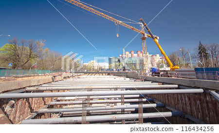 A large huge ditch pit tunnel timelapse hyperlapse at the construction site of the underground metro station line. 116434256