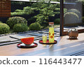 Watermelon, cold tea and mosquito repellent pig placed on the veranda of a Japanese house in summer / Summer vacation, homecoming, rural home, Showa retro image 116443477