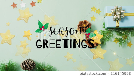 Image of season greetings text and stars over presents and decorations 116145998