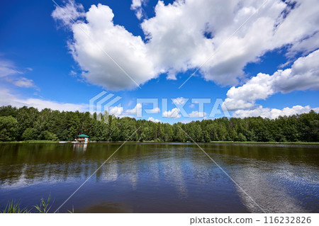 Beautiful summer river at sunny day with clouds reflection in the water 116232826