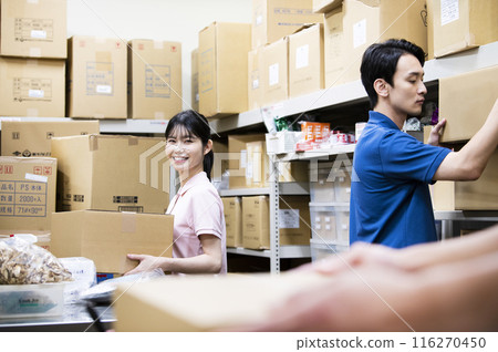 A woman working in a warehouse 116270450