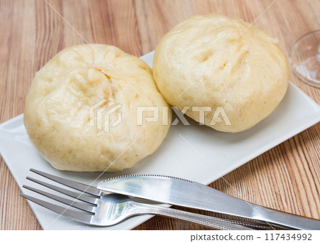 Traditional Chinese steamed buns Xiaolongbao stuffed with pork 117434992