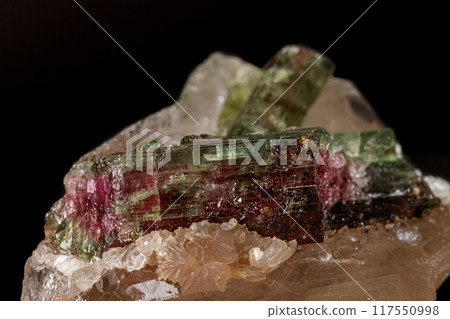 Macro stone tourmaline mineral on a black background  117550998