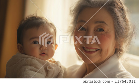 Grandmother holding a baby 117643011