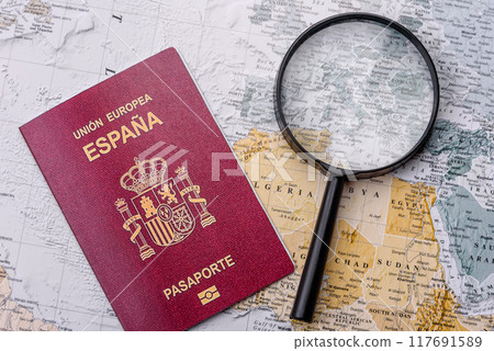 Conceptual background for travel with passport, magnifying glass, world map and money 117691589