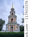 A tall old Russian bell tower against the sky in summer 117933376