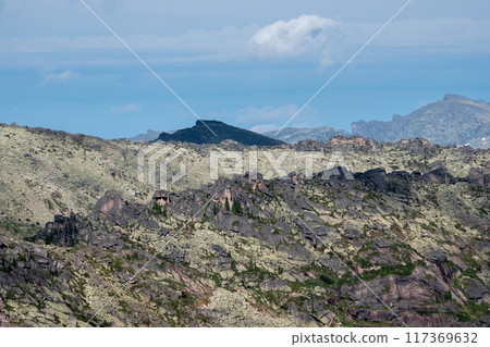 Rocky mountains landscape. Big cracked pointed stones. 117369632