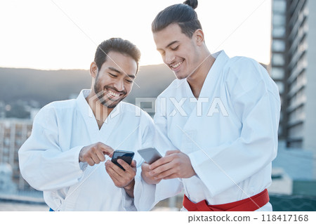 Happy, karate and men with phone in the city for martial arts, app information or social media. Smile, laughing and friends with a mobile for taekwondo training, fitness or a workout check online 118417168