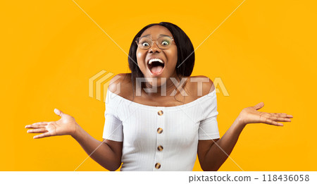 Wow. Excited Afro Girl Shouting Looking At Camera Gesturing With Hands Standing On Orange Studio Background. Panorama 118436058