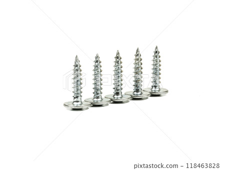 Five self-tapping screws of the same size on a light background. On a light background there are five self-tapping screws of the same size 118463828