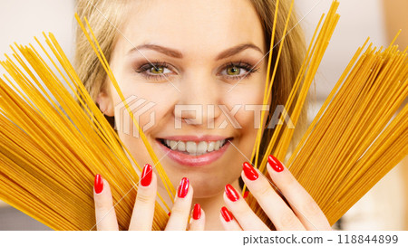 Woman holding long pasta 118844899