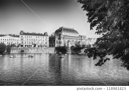 Tourists enjoying paddle boats with the National Theatre in Prague 118981823