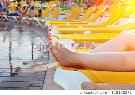 Girl lying in hammock by the pool 118188271